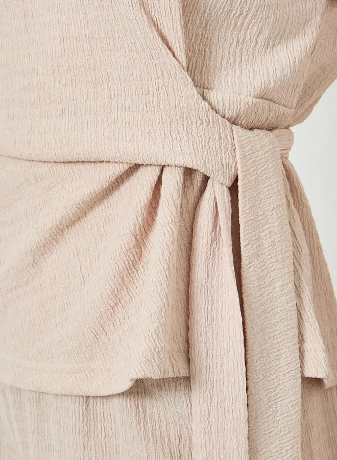 ستايلي طقم كريمي بلوزة بملمس بارز وبنطال أرجل واسعة